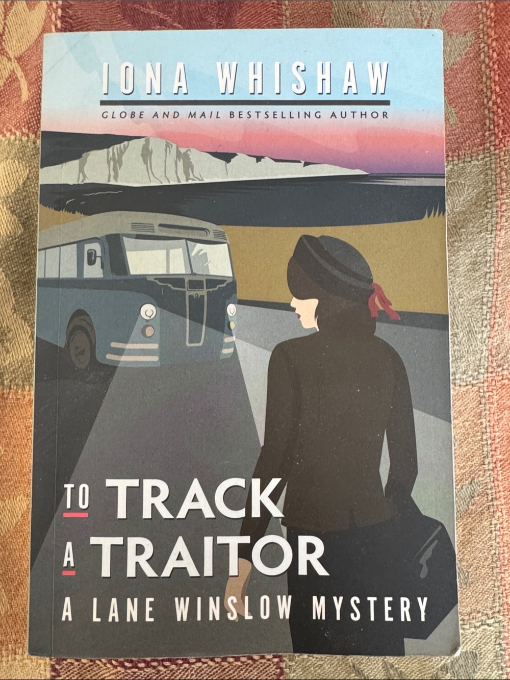 To Track a Traitor by Iona Whishaw (a Lane Winslow mystery novel)